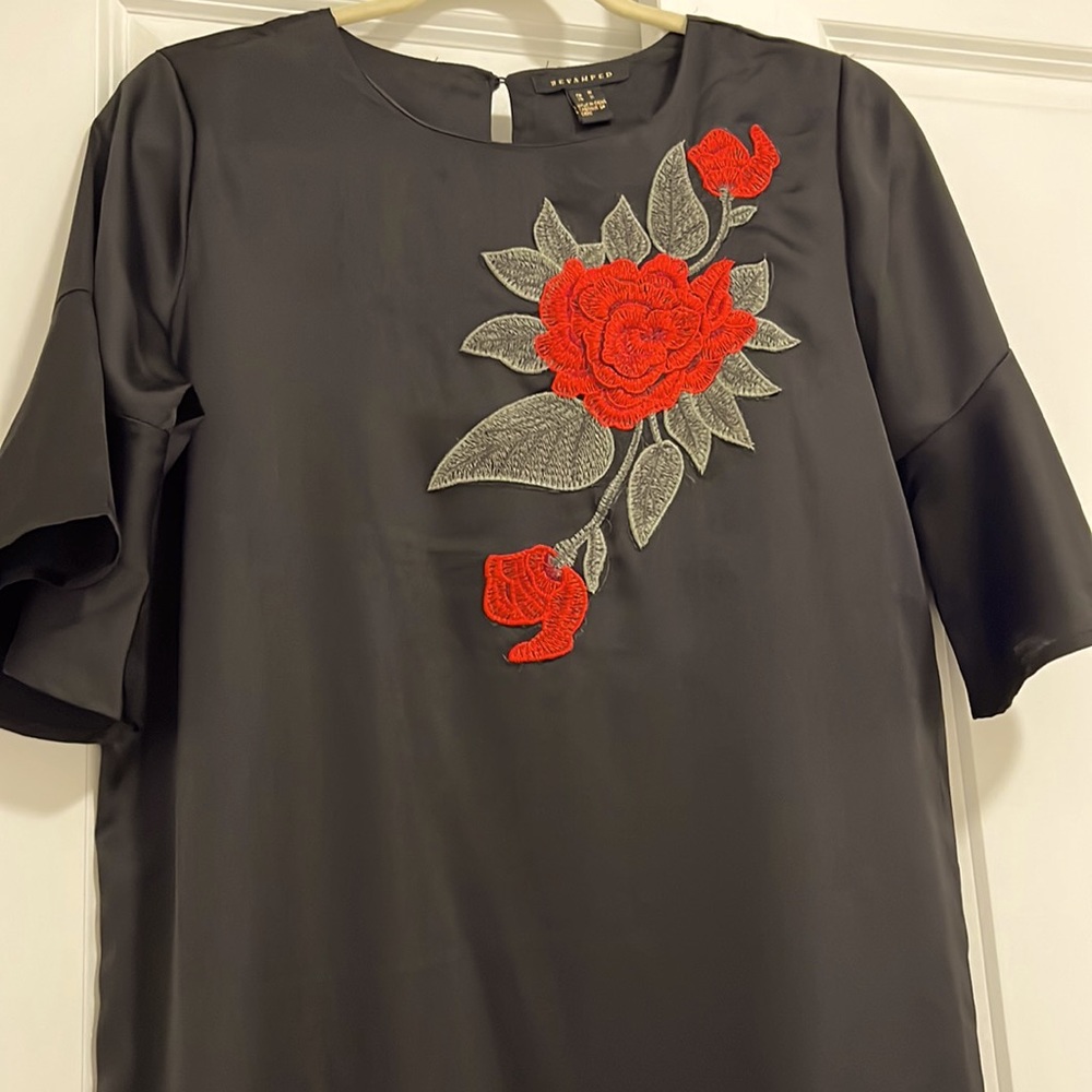 Black dress with red flower embroidered detail with cute flared bottom tail